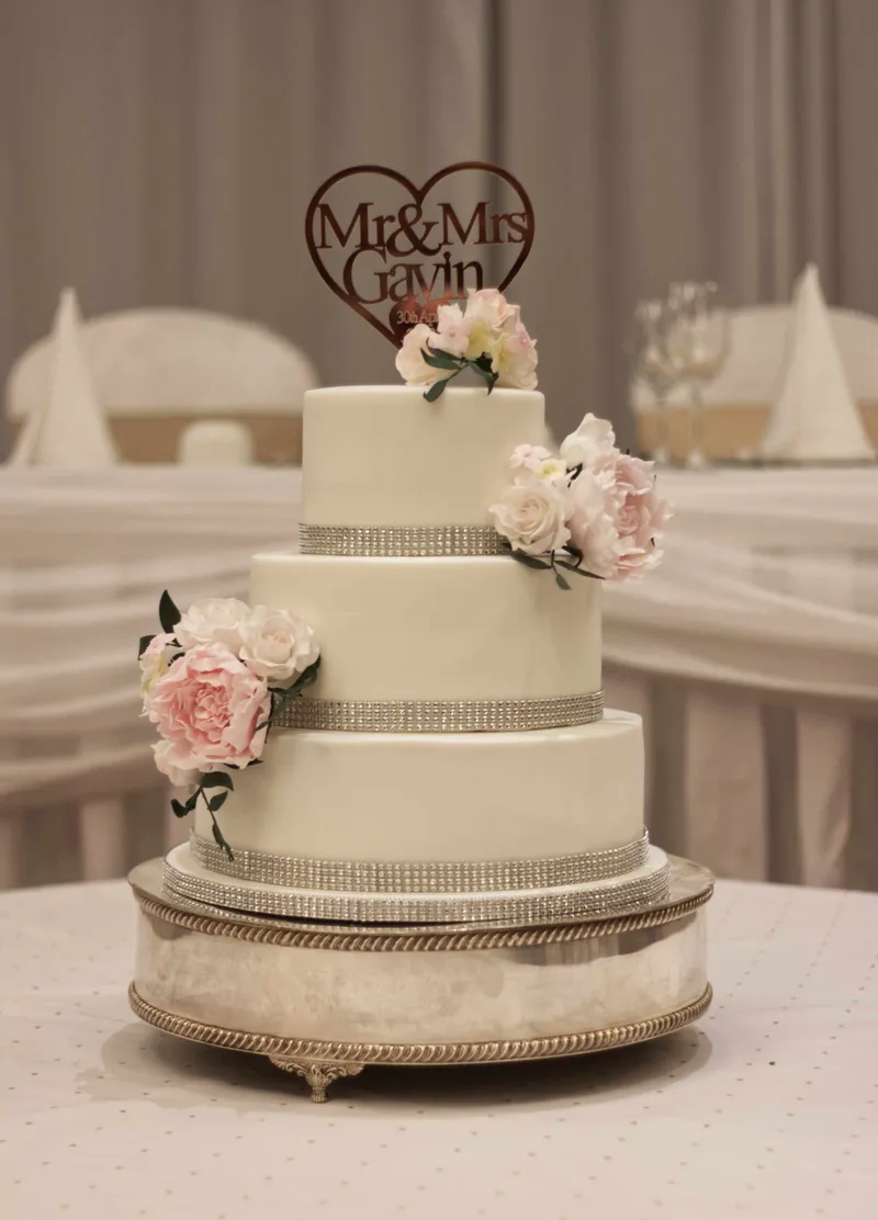 Blush wedding cake with sugar peonies and roses