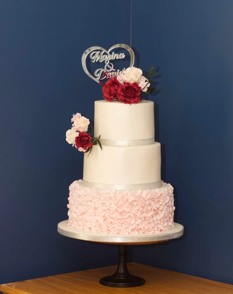 Wedding cake with ruffles and sugar roses